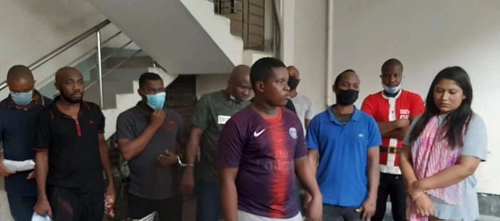 12 Nigerian nationals and a former Dhaka University student at the CID headquarters in Dhaka. They have been arrested for various involvement in various scams in Bangladesh. 21 July 2020
