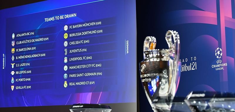 This handout photograph taken and released on 14 December 2020 by the Union of European Football Associations (UEFA) shows the trophy displayed on stage prior to the draw for the round of 16 of the UEFA Champions League football tournament at the UEFA headquarters in Nyon. 