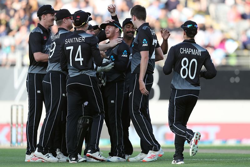 New Zealand’s players celebrate the wicket of Pakistan's Mohammad Rizwan during the first T20 international cricket match between New Zealand and Pakistan at Eden Park in Auckland on 18 December, 2020