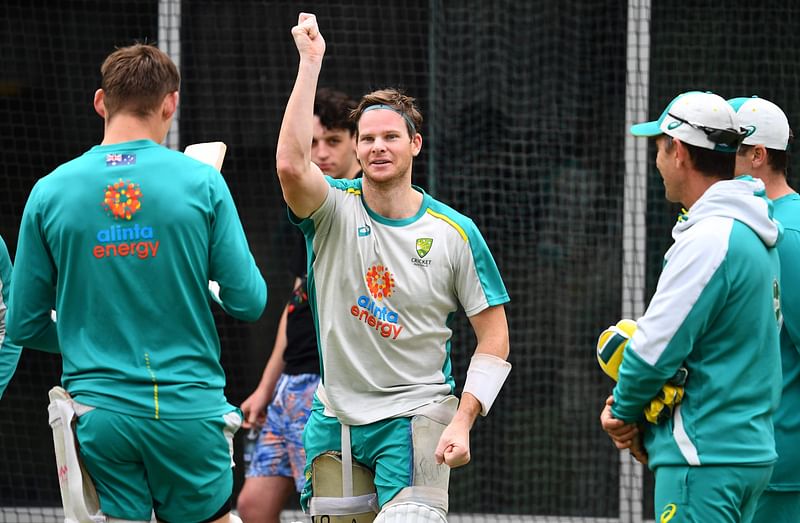 Australia's batsman Steve Smith (C) entertains teammates during a training session ahead of the second cricket Test match against India, in Melbourne on 25 December, 2020