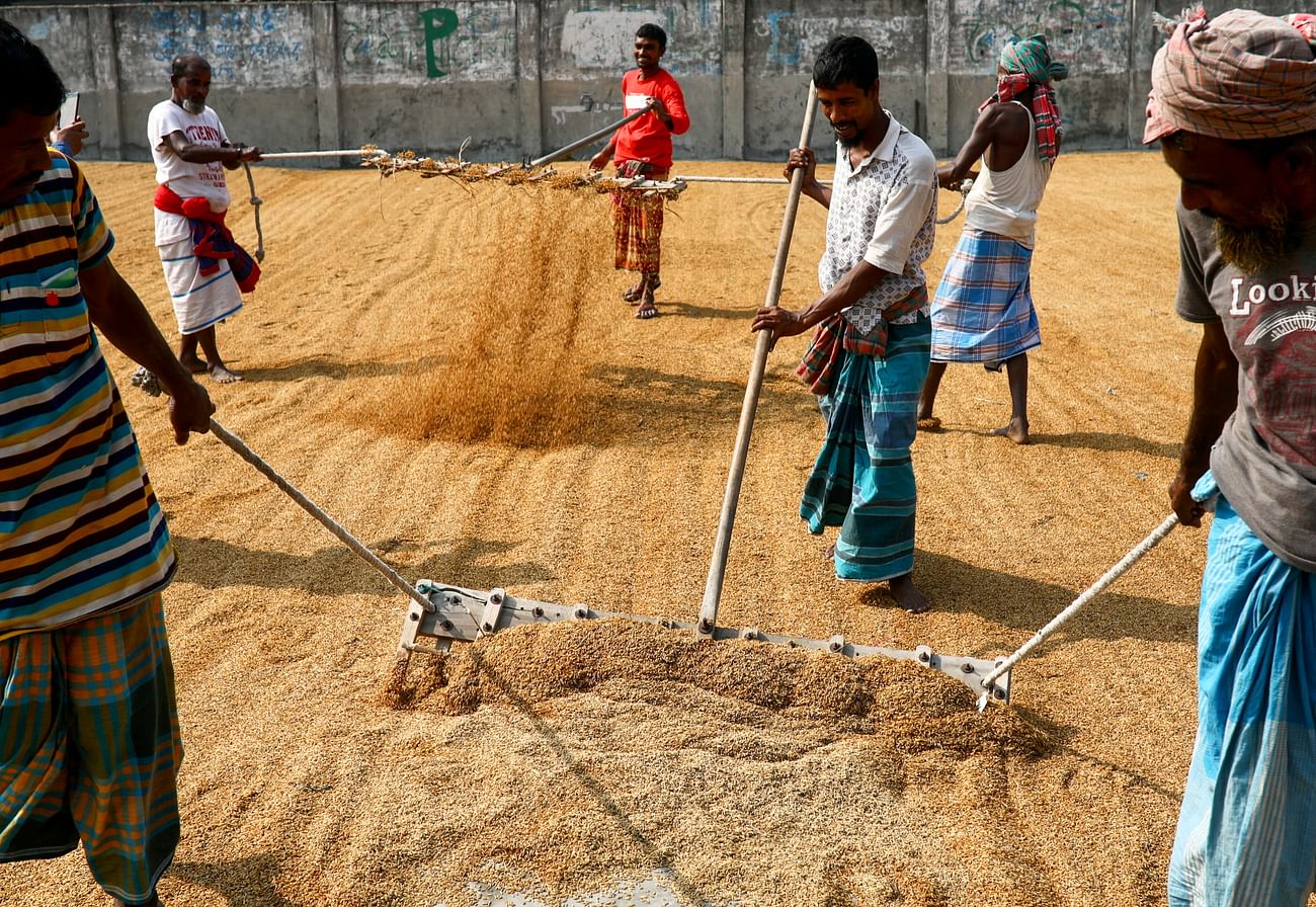 People work in a rice processing mill in Munshiganj, Bangladesh on 4 January 2021