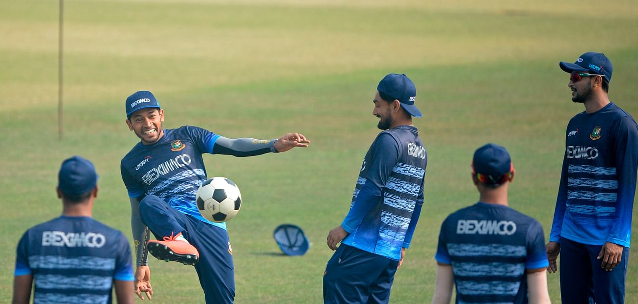 Bangladesh's Mushfiqur Rahim (2L) plays soccer along with his teammates during a practice session at the Zohur Ahmed Chowdhury Stadium in Chittagong in 24 January, 2021