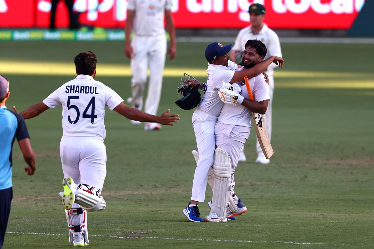  India's batsman Rishabh Pant (R) celebrates victory with teammates in the fourth cricket Test match against Australia at The Gabba in Brisbane on  19 January, 2021