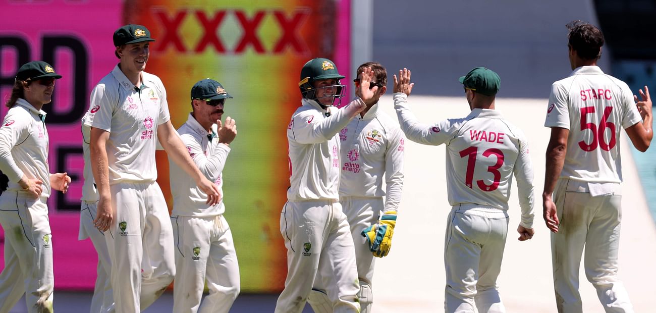 ustralia's Marnus Labuschagne (C) celebrates with teammates after the dismissal of India's Jasprit Bumrah on the third day of the third cricket Test match between Australia and India at the Sydney Cricket Ground (SCG) in Sydney on 9 January 2021