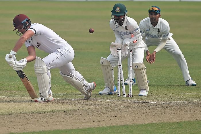 West Indies' Joshua Da Silva (L) is dismissed by Bangladesh's Taijul Islam (unseen) as Bangladesh's wicketkeeper Liton Das (C) watches during the second day of the second Test cricket match between West Indies and Bangladesh at the Sher-e-Bangla National Cricket Stadium in Dhaka on 12 February 2021