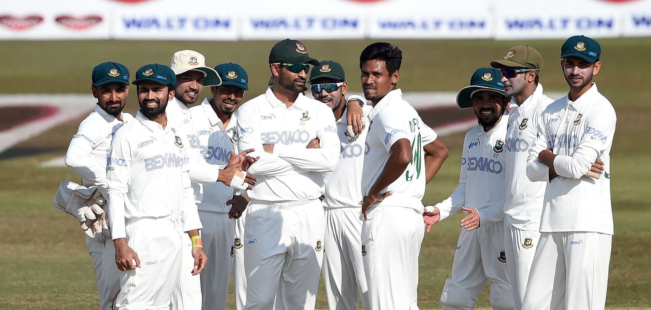 Bangladesh' players celebrate after the dismissal of West Indies' John Campbell (not pictured) during the second day of the first cricket Test match between Bangladesh and West Indies at the Zohur Ahmed Chowdhury Stadium in Chittagong on 4 February, 2021