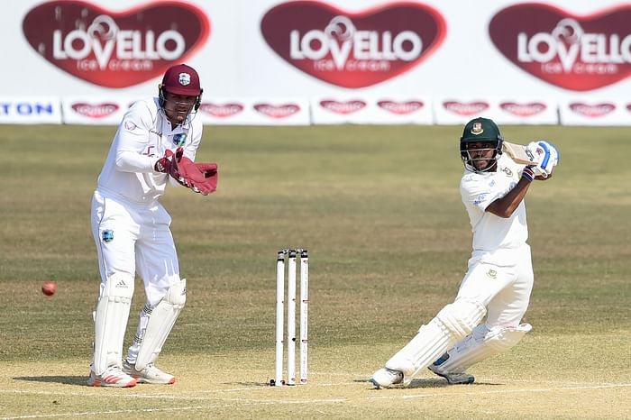 Mehidy Hasan Miraz (R) plays a shot during the second day of the first cricket Test match between Bangladesh and West Indies at the Zohur Ahmed Chowdhury Stadium in Chittagong on 4 February, 2021