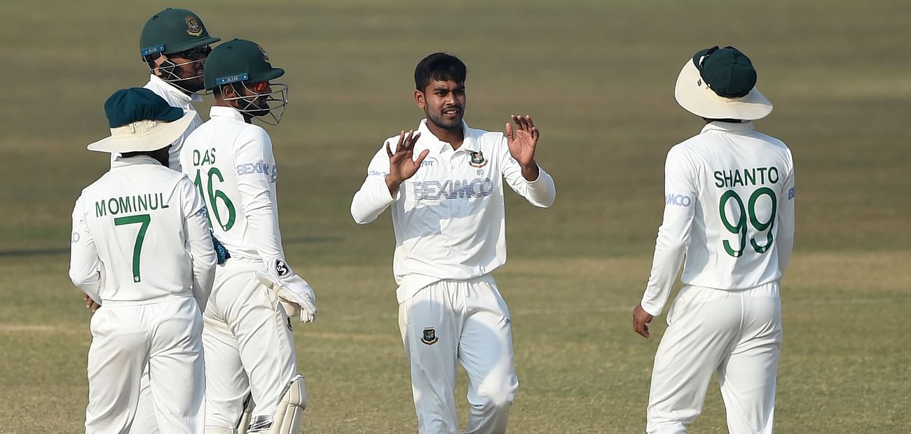 Mehidy Hasan Miraz (C) celebrates with teammates after the dismissal of West Indies' Shayne Moseley (not pictured) during the fourth day of the first cricket Test match between Bangladesh and West Indies at the Zohur Ahmed Chowdhury Stadium in Chittagong on 6 February, 2021