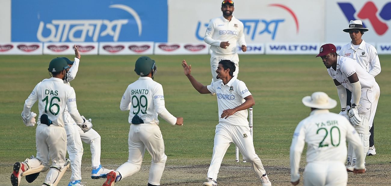 Bangladesh's cricketers celebrate after the dismissal West Indies' John Campbell (not pictured) during the third day of the second Test cricket match between West Indies and Bangladesh at the Sher-e-Bangla National Cricket Stadium in Dhaka in 13 February, 2021