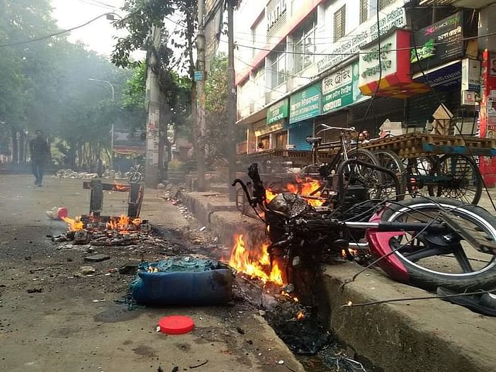 While clashing with police, the incident of vandalism and torching takes place in front of BNP office in Chattogram on Monday. The motorbike is also set on fire.

