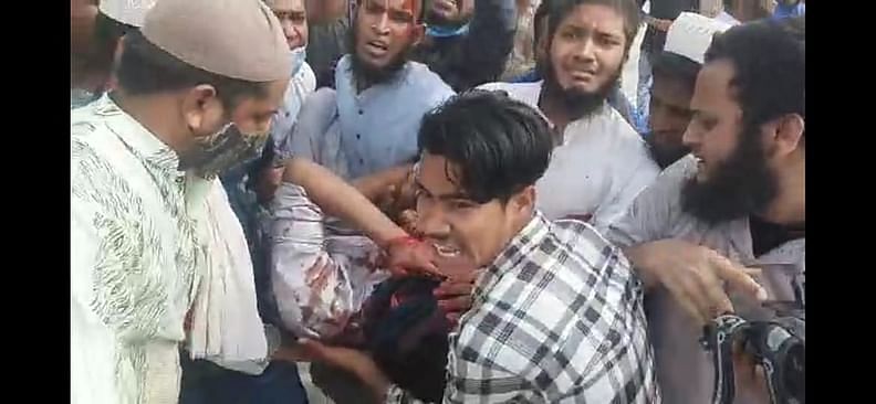 An injured person is being taken away