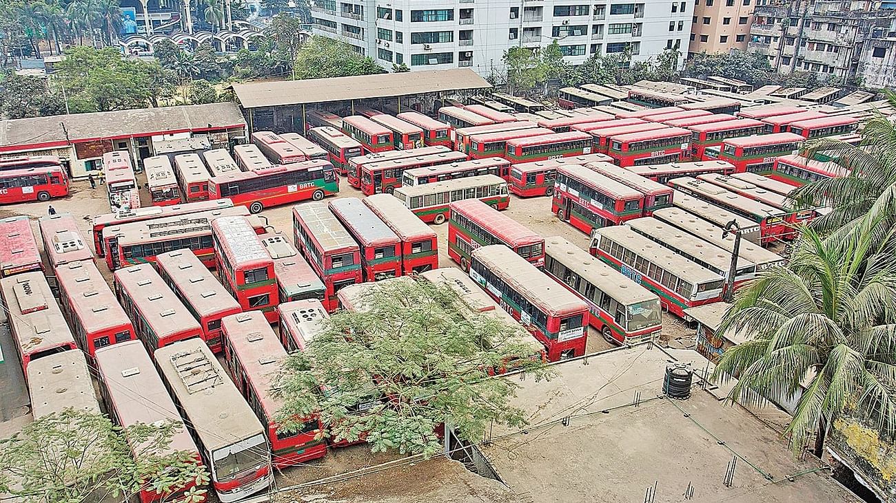 This recently taken photo shows sand covering busses parked at BRTC Kamalapur bus depot in Dhaka. 