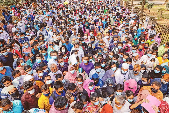 Amid risk of Covid-19 infection, crowds of guardian waiting outside one center of medical college admission test in Dhaka University. The photo was taken on 2 April 2021