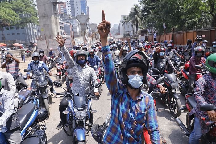 Bikers, who take trips using ridesharing apps, demonstrate against the government’s two-week ban on bike ridesharing services in the capital on Thursday. 