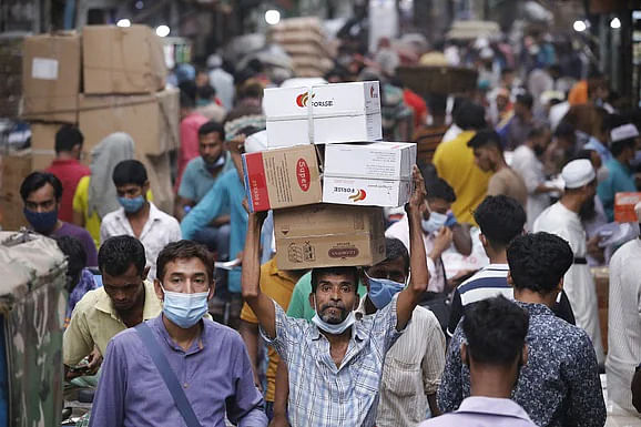 Trading get a boost at Dhaka city's largest wholesale market Moulvibazar as the government is going to impose a seven-day lockdown from 5 April 2021. 