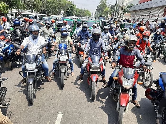 Ridesharing bikers stage demonstration in the city's Tejgaon area on Wednesday morning. 