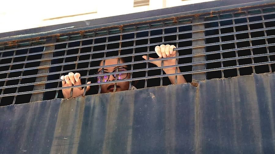 Pori Moni being taken to jail in a prison van