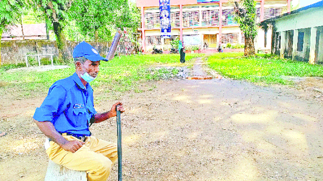 A village cop stands guard at Purbavag Model Government Primary School polling centre in Dakshin Surma upazila during the Sylhet-3 by-polls on Thursday