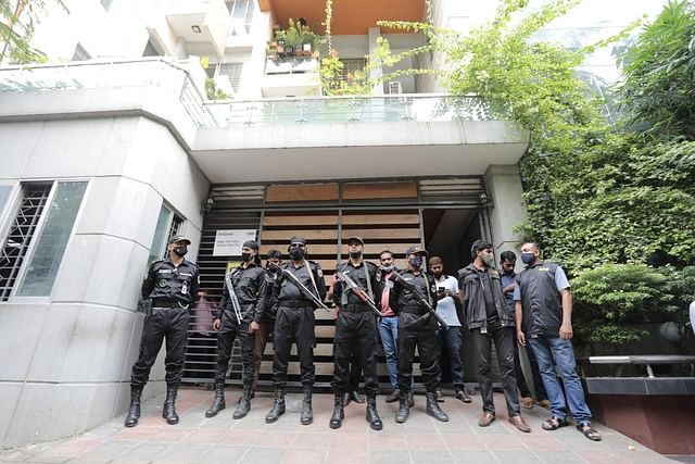 Members of Rapid Action Battalion stand guard in front of Evaly CEO Mohammad Rassel’s residence in Dhaka’s Mohammadpur during a raid on Thursday, 16 September 2021. 