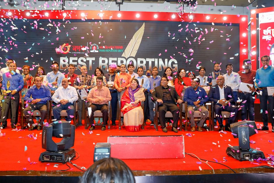 Receipts of the Nagad-Dhaka Reporters Unity Best Reporting Award-2021 pose for picture with the speaker of parliament Shirin Sharmin Chaudhury at Krishibid Institution Bangladesh in the capital on Tuesday. 