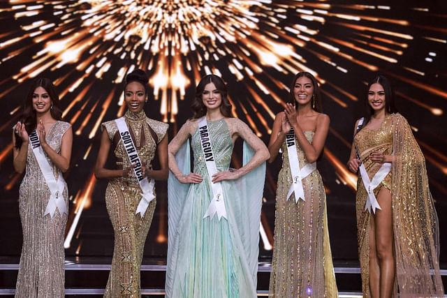 The top five Miss Universe contestants (L to R) Miss India, Harnaaz Sandhu; Miss South Africa, Lalela Mswane; Miss Paraguay, Nadia Ferreira; Miss Colombia, Valeria Ayos; and Miss Philippines, Beatrice Gomez pose on stage during the 70th Miss Universe beauty pageant in Israel's southern Red Sea coastal city of Eilat on December 13, 2021