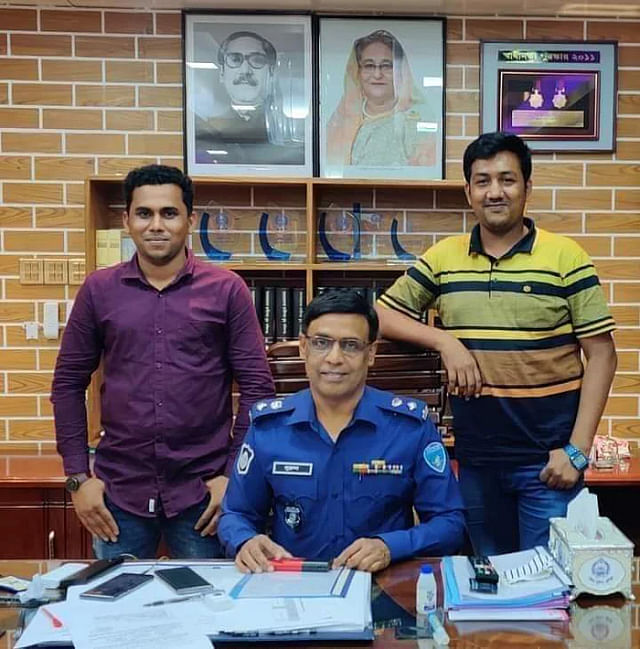 Chhatra League leaders with police official Syed Nurul Islam. 
