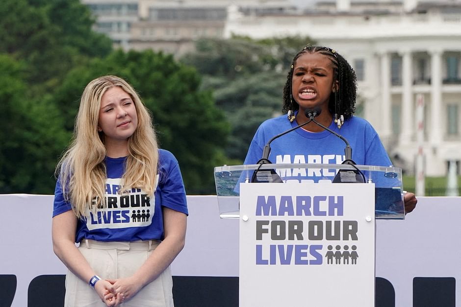 Jaclyn Corin, lead organiser for March For Our Lives and survivor of the 2018 shooting at Marjory Stoneman Douglas High School, listens as Yolanda King, granddaughter of Martin Luther King Jr., speaks during 'March for Our Lives', one of a series of nationwide protests against gun violence, in Washington, D.C., U.S., 11 June 2022. 