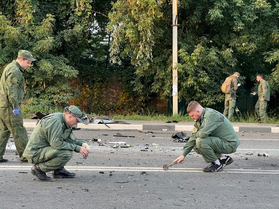 Investigators work at the site of a suspected car bomb attack that killed Darya Dugina, daughter of ultra-nationalist Russian ideologue Alexander Dugin, in the Moscow region, Russia on 21 August, 2022