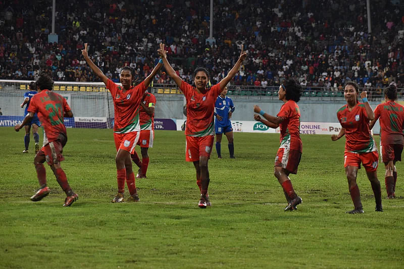 Bangladesh women's national team footballers celebrate win against Nepal in the final of SAFF Women's Championship on 19 September 2022  