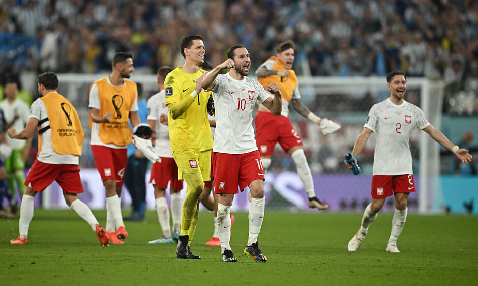 Poland's Grzegorz Krychowiak celebrates after the match as Poland qualify for the knockout stages