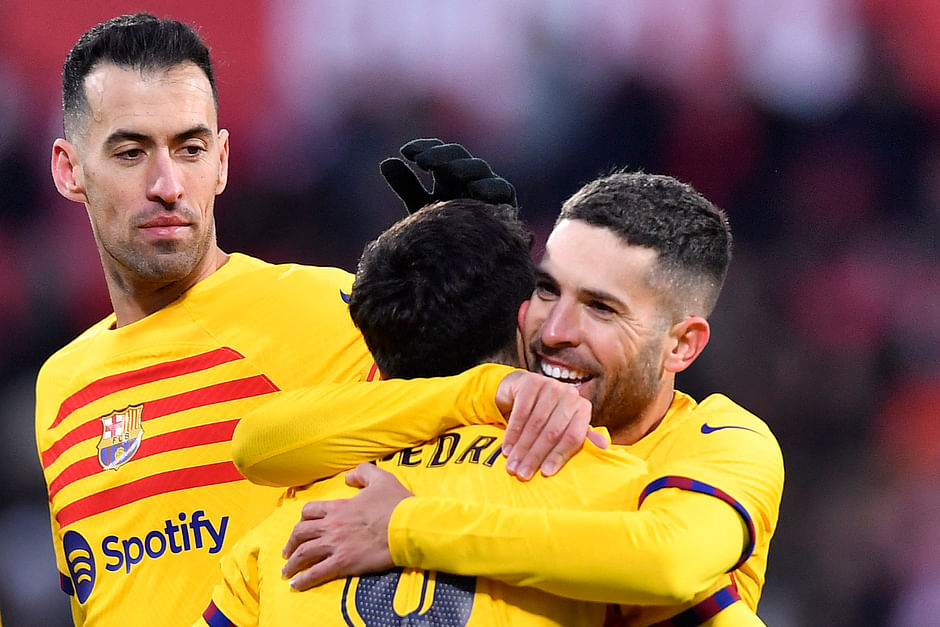 Barcelona's Spanish midfielder Pedri embraces Jordi Alba after scoring the goal
