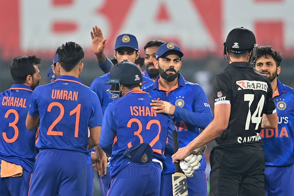 New Zealand's Mitchell Santner (2R) greets India's players at the end of the third and final ODI