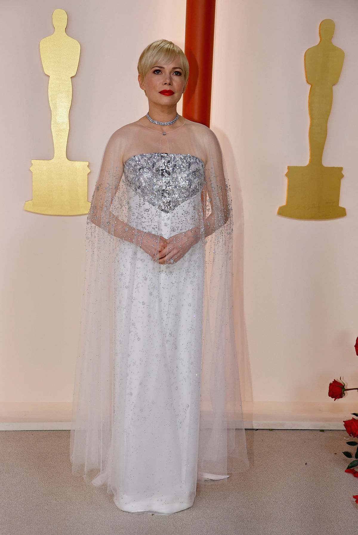 Michelle Williams poses on the champagne-colored red carpet during the Oscars arrivals at the 95th Academy Awards in Hollywood, Los Angeles, California, US, 12 March, 2023. 