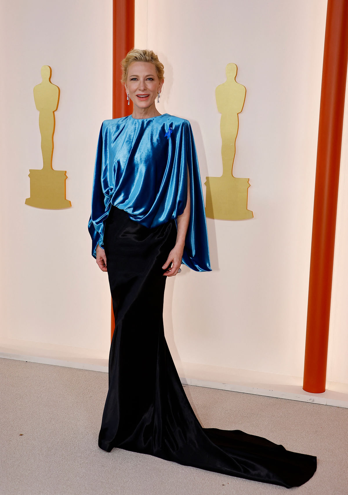 Cate Blanchett poses on the champagne-colored red carpet during the Oscars arrivals at the 95th Academy Awards in Hollywood, Los Angeles, California, US, 12 March, 2023. 