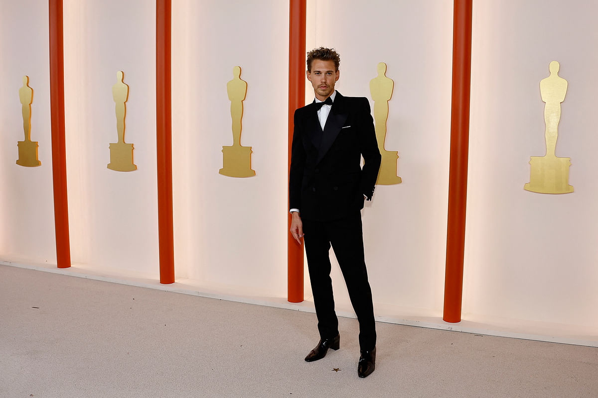 Austin Butler poses on the champagne-colored red carpet during the Oscars arrivals at the 95th Academy Awards in Hollywood, Los Angeles, California, US, 12 March 2023. 