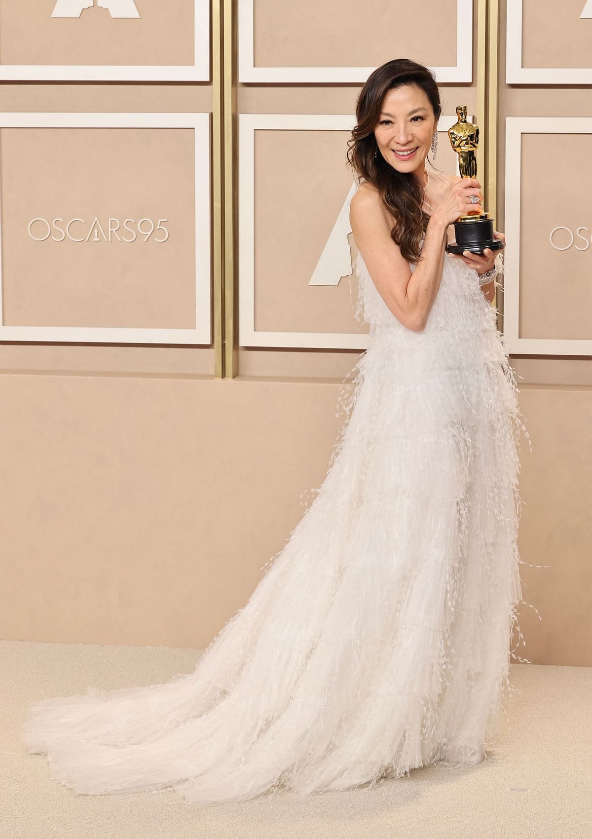 Michelle Yeoh, who won the best actress Oscar for ‘Everything Everywhere All At Once’, wore sparkling silver in her hair and a feathery white Dior gown on 12 March, 2023 in Hollywood, California, US.