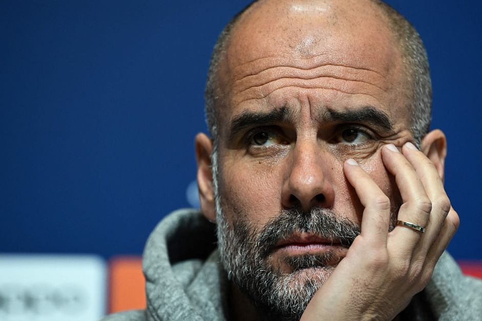 Manchester City's Spanish manager Pep Guardiola reacts as he attends a press conference