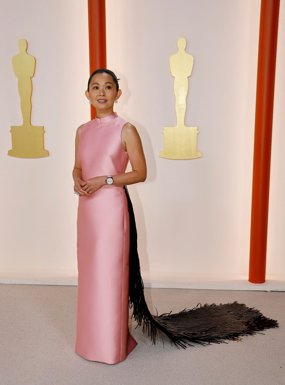 Hong Chau poses on the champagne-colored red carpet during the Oscars arrivals at the 95th Academy Awards in Hollywood, Los Angeles, California, US, 12 March, 2023. 