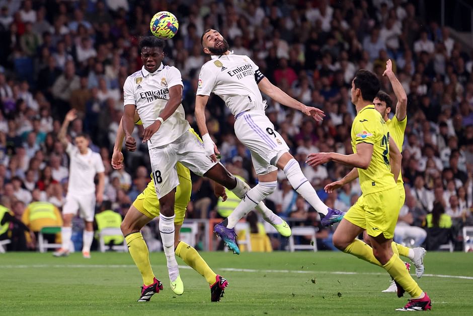 Real Madrid's French defender Aurelien Tchouameni and French forward Karim Benzema jump for a header during the La Liga match between Real Madrid CF and Villarreal CF at the Santiago Bernabeu stadium in Madrid on 8 April 2023
