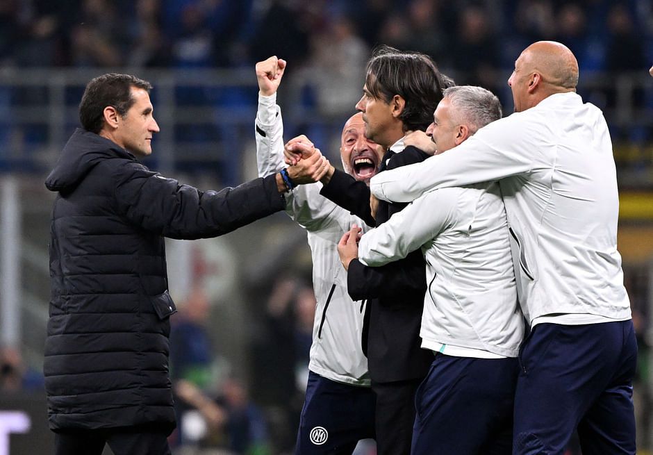 Inter Milan coach Simone Inzaghi celebrates with the coaching staff after the match