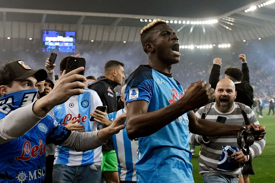 Napoli fans join Napoli's Nigerian forward Victor Osimhen as he celebrates