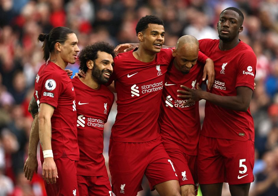 Liverpool's Egyptian striker Mohamed Salah celebrates with teammates after scoring his team's first goal during the English Premier League match between Liverpool and Brentford at Anfield in Liverpool, England on 6 May 2023