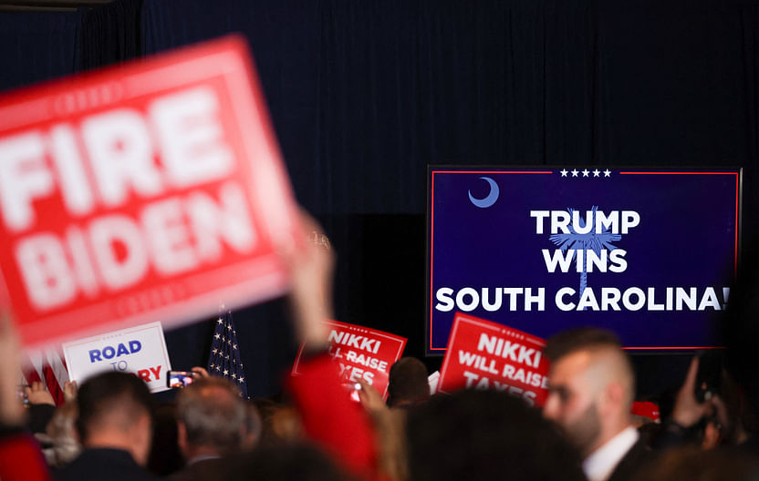 A screen displays "Trump wins South Carolina" during Republican presidential candidate and former US President Donald Trump's South Carolina Republican presidential primary election night party, in Columbia, South Carolina, US 24 February, 2024. 