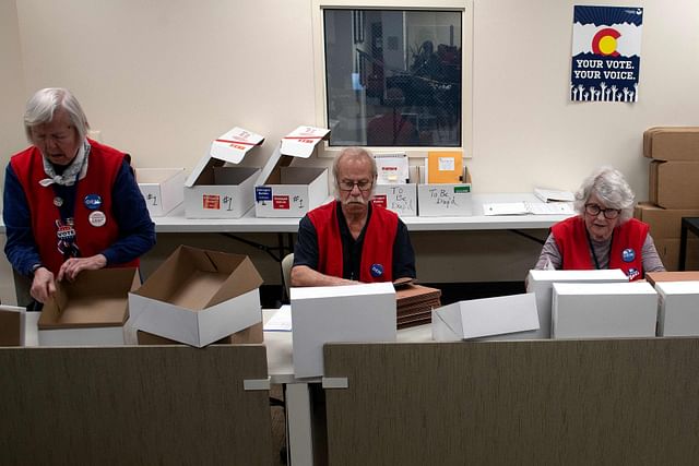 Election judges prepare boxes for the arrival of precinct ballots at the Denver Elections Division during the presidential primary in Denver, Colorado on Super Tuesday, on 5 March, 2024