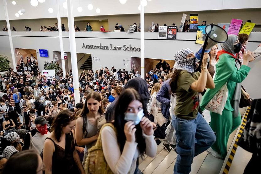 People demonstrate in the ABC building of the University of Amsterdam on the Roeterseiland campus in central Amsterdam on 13 May, 2024 in the wake of similar protests of students at universities in several European countries that have followed the actions on US campuses where demonstrators have occupied halls and facilities to demand an end to partnerships with Israeli institutions because of Israel’s punishing assault on Gaza