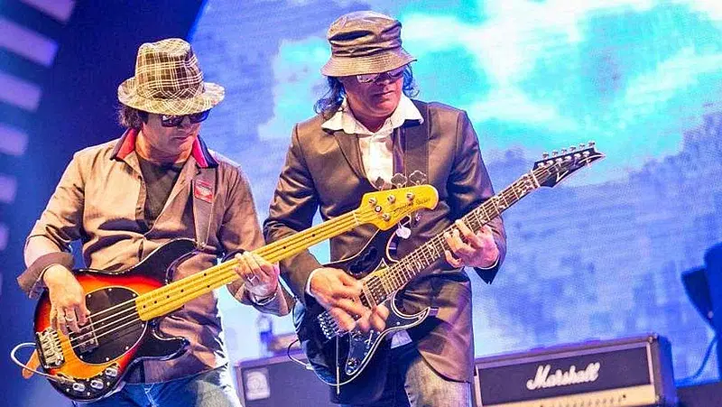 Hamin Ahmed and Shafin Ahmed playing guitar together