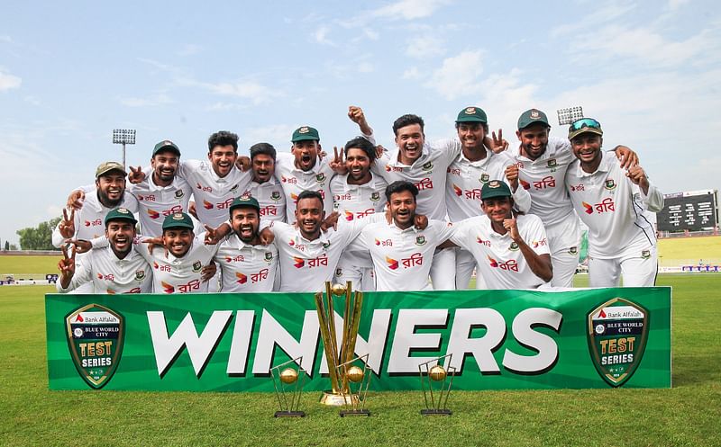 Bangladesh team pose for a photograph with the trophy