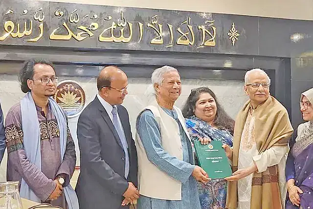 Electoral system reform commission chief Badiul Alam Majumder hands over the report to the Chief Adviser Dr Muhammad Yunus.