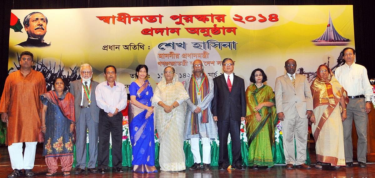 Prime minister Sheikh Hasina poses for a photograph along with the Independence Day award winners at Osmani Memorial auditorium. Photo: Focus Bangla