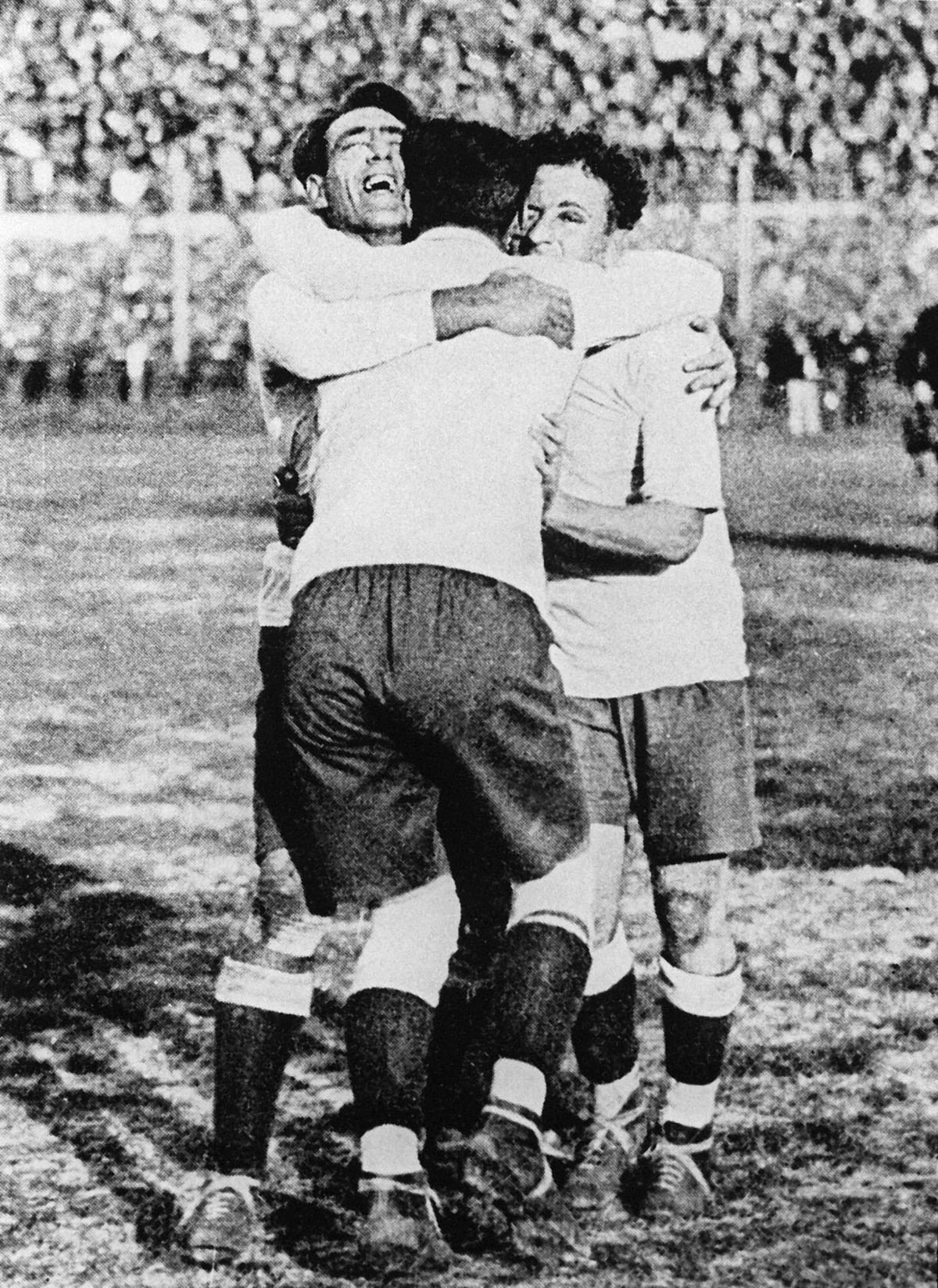 Uruguayans Pedro Cea, Hector Scarone and Hector Castro (from L) celebrate after Uruguay beat Argentina 4-2 in the first-ever World Cup soccer final in Montevideo 30 July 1930. Photo: AFP